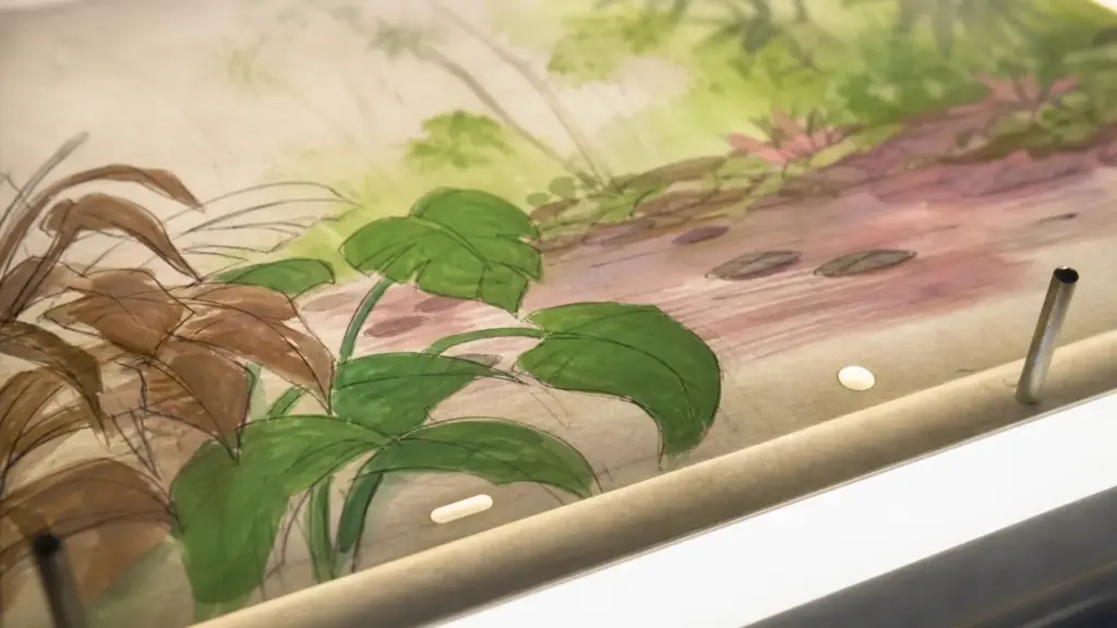 serie iggy arbuckle: detalle de una hoja de animación pintada sobre una mesa de luz con tonos de selva y pantano