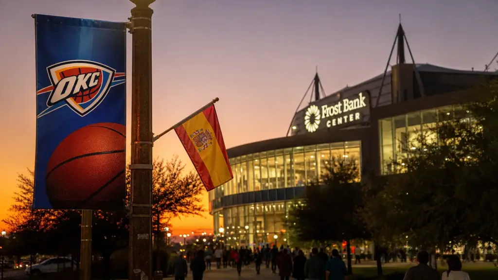 debut de aday mara: aficionados anónimos caminan al atardecer hacia un pabellón de baloncesto en San Antonio con un cartel de OKC y una bandera de España